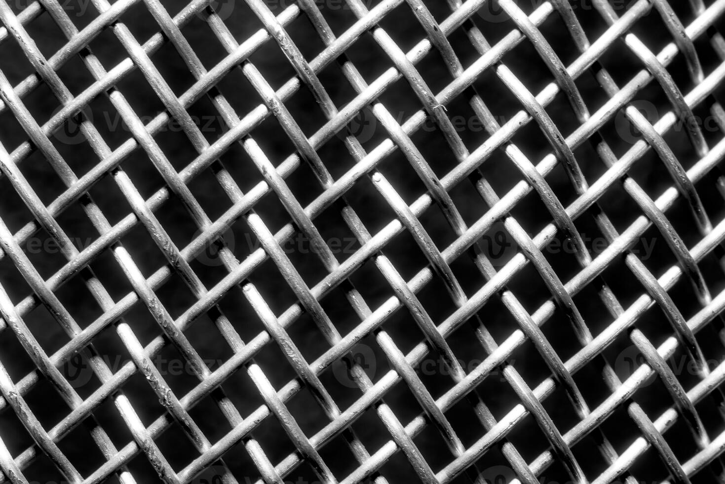 monocromo textura de un brillante metal colador o rallar. resumen antecedentes. foto