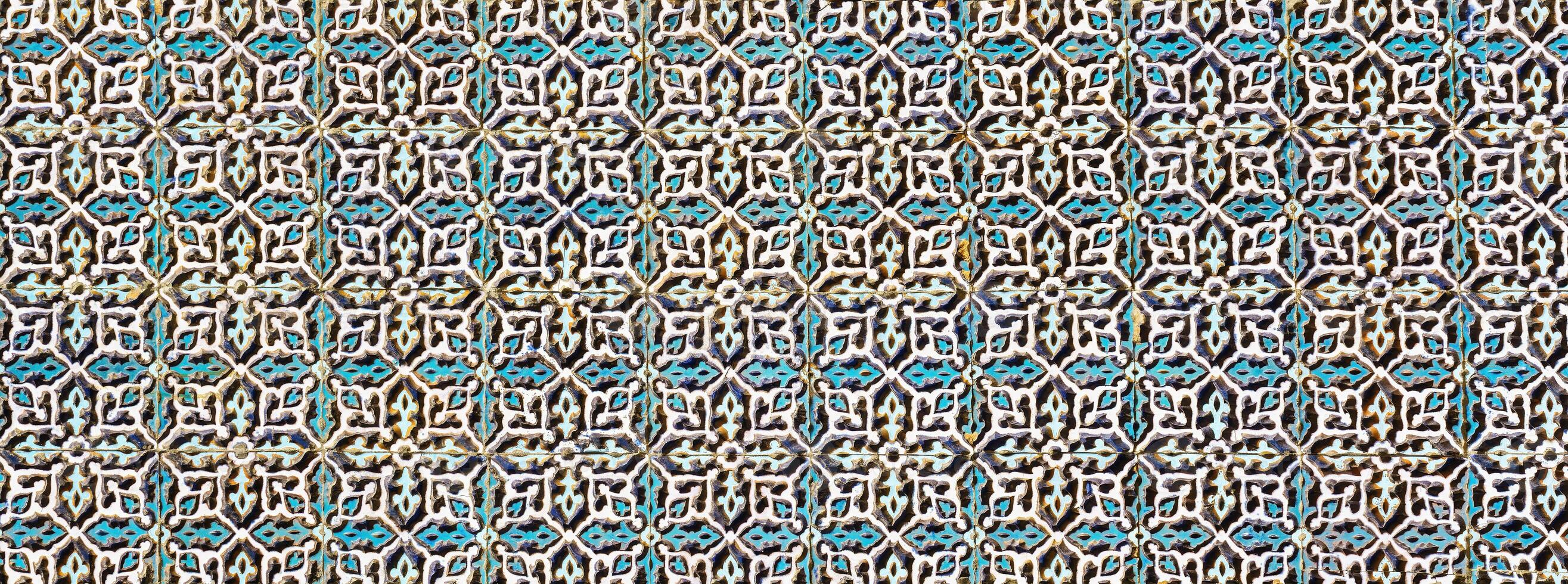 Geometric traditional Islamic ornament. Fragment of a ceramic mosaic. photo