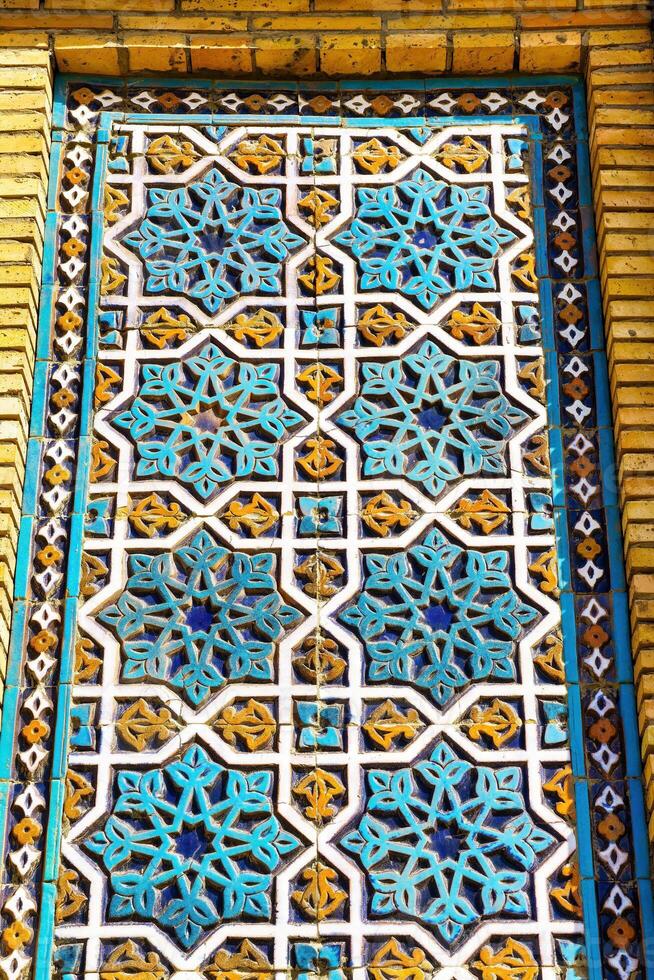 Geometric traditional Islamic ornament. Fragment of a ceramic mosaic. photo