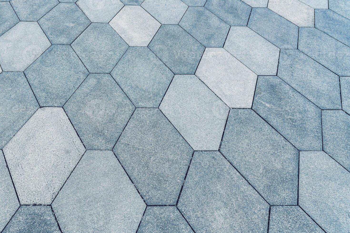 The texture of a tiled pavement with perspective. photo