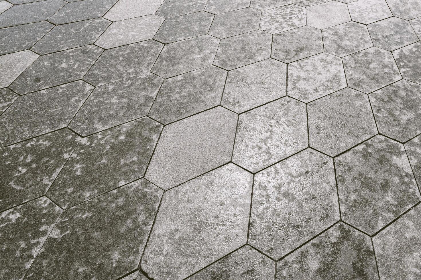 The texture of hexagonal tiled pavement with perspective. photo