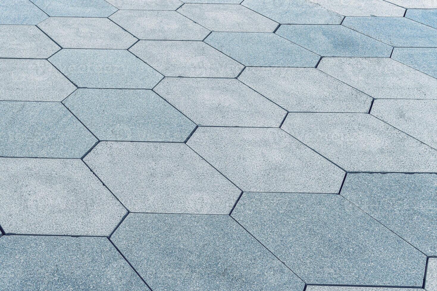 The texture of hexagonal tiled pavement with perspective. photo