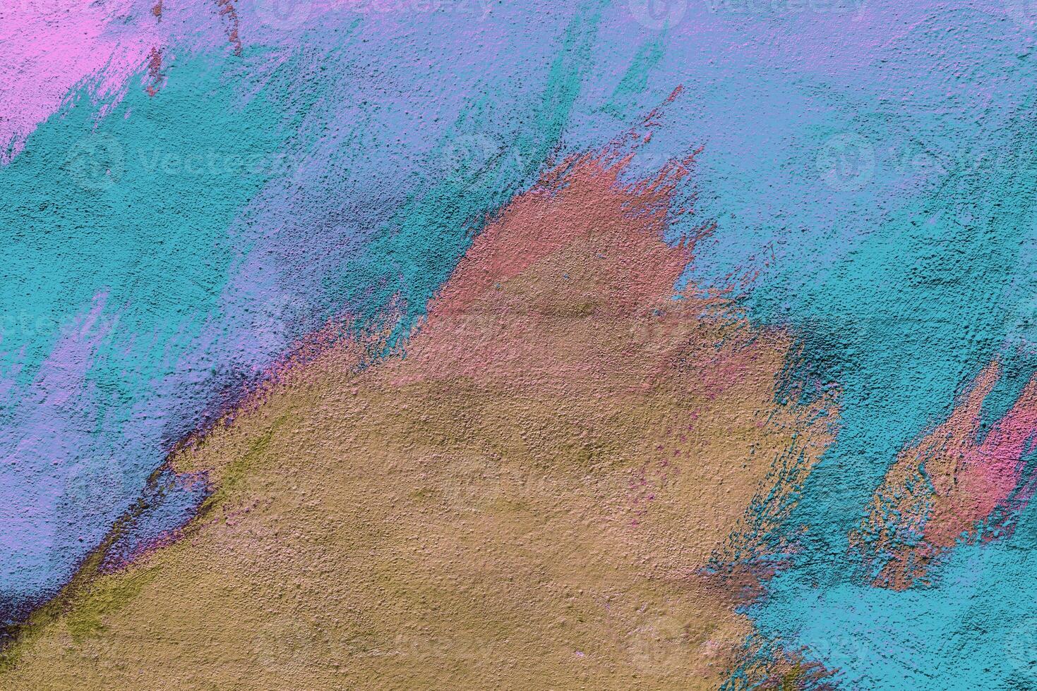 Colorful graffiti painted on a wall. Abstract urban background. Spray painting art. photo