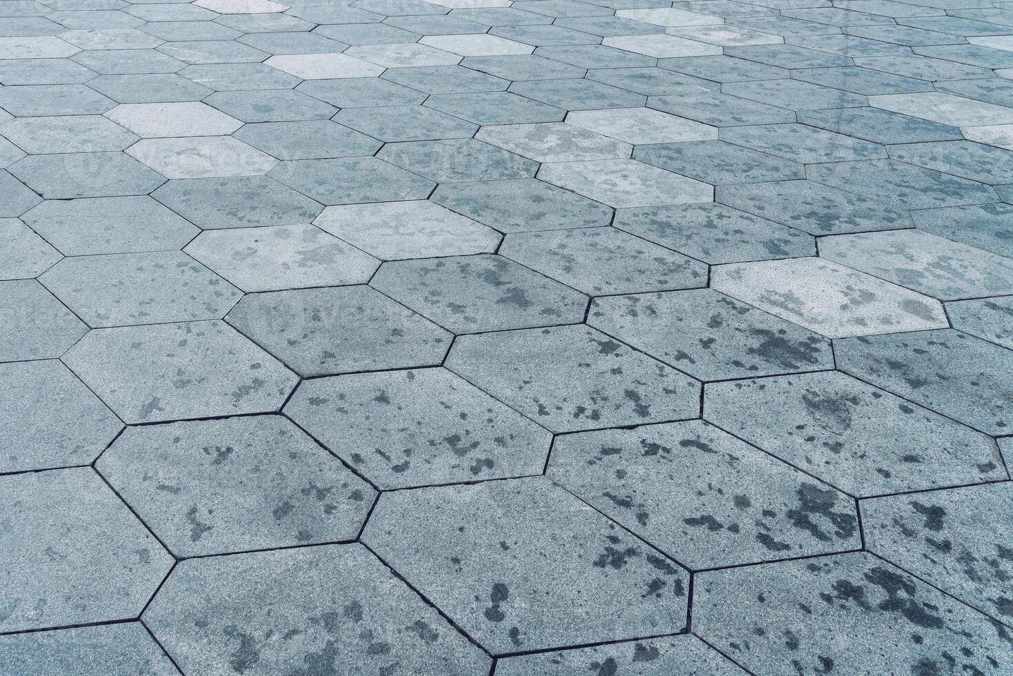 The texture of hexagonal tiled pavement with perspective. photo