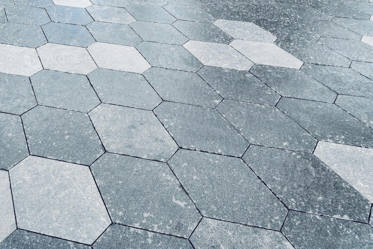 The texture of hexagonal tiled pavement with perspective. photo