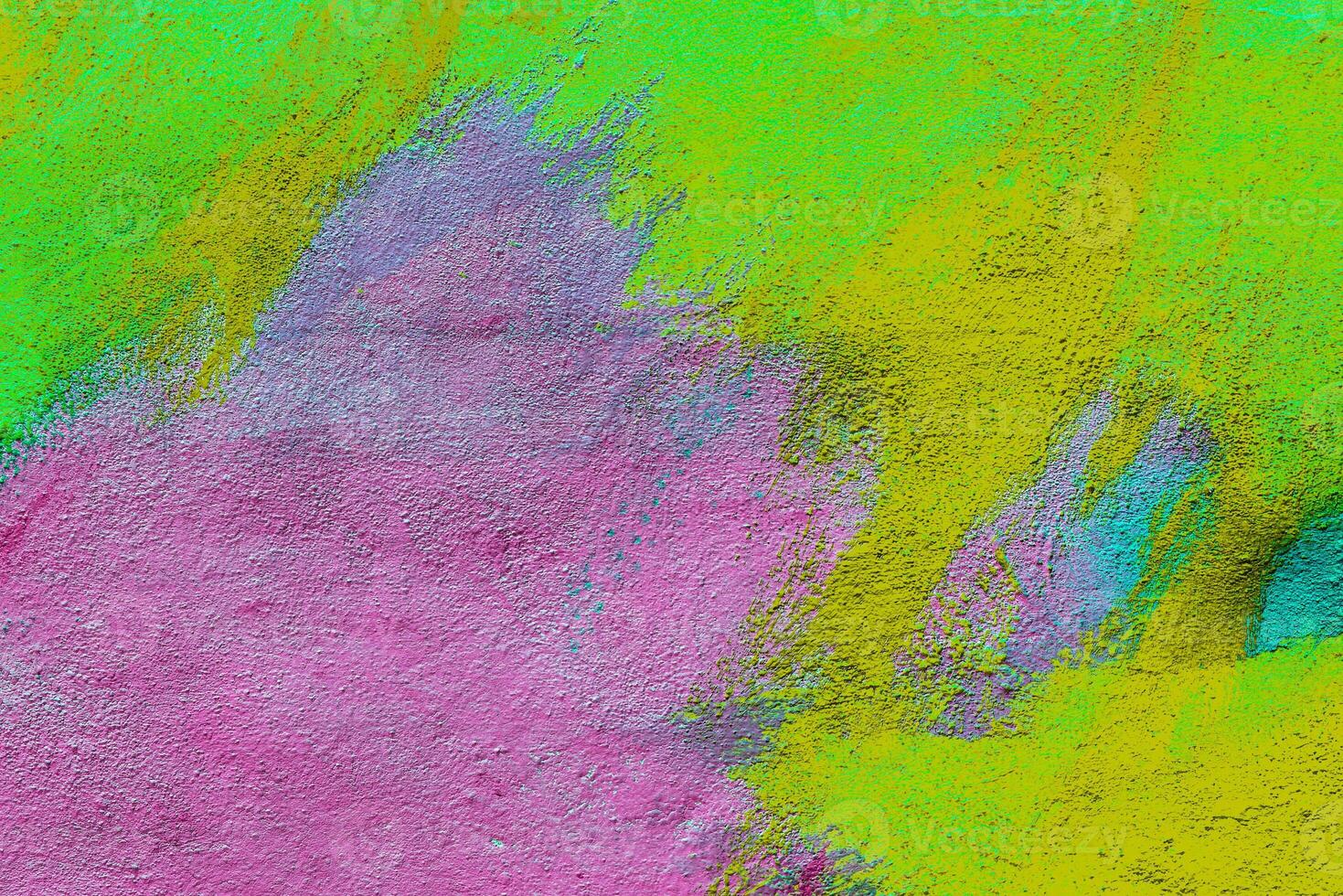 Colorful graffiti painted on a wall. Abstract urban background. Spray painting art. photo