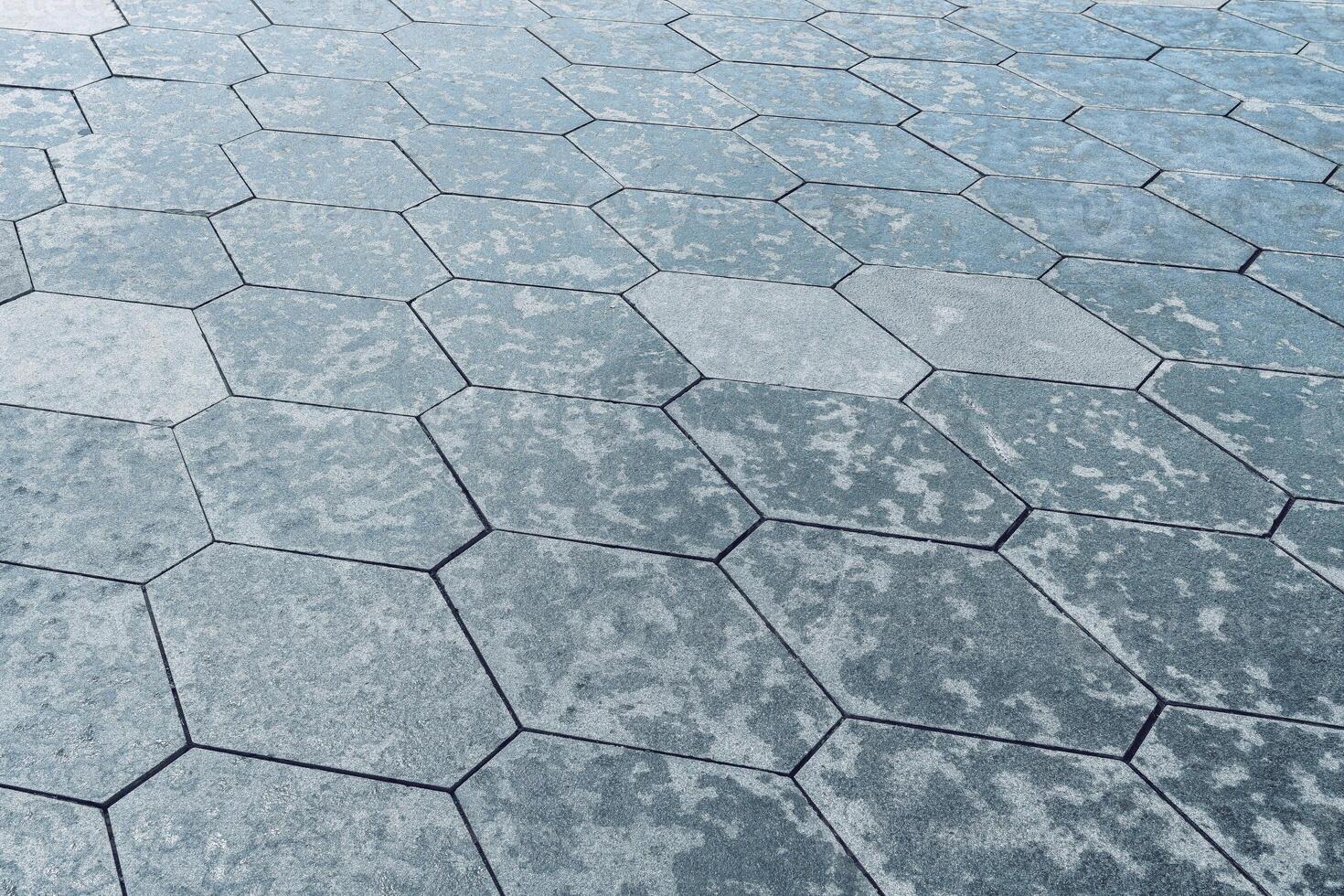 The texture of hexagonal tiled pavement with perspective. photo