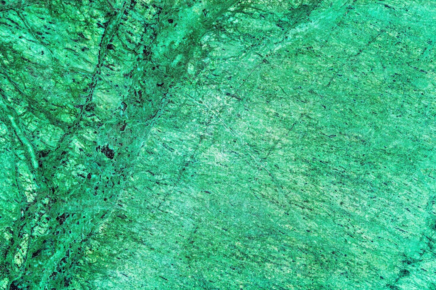 Texture of green marble tiles with scratches. Abstract background. photo