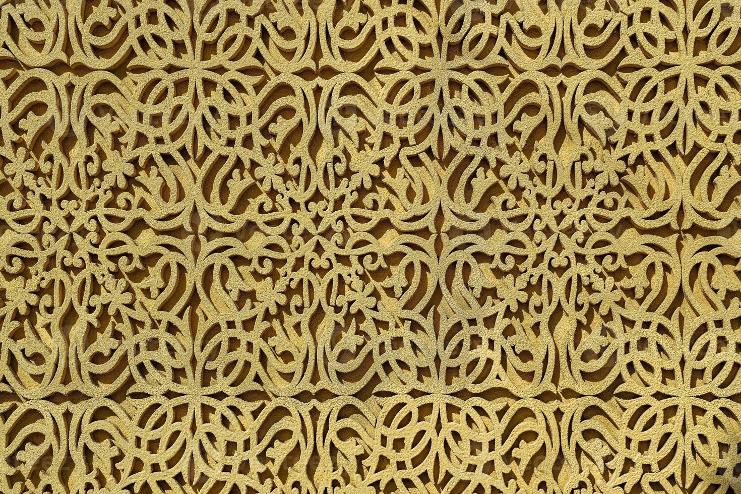 Geometric traditional Islamic ornament. Fragment of a concrete mosaic. photo