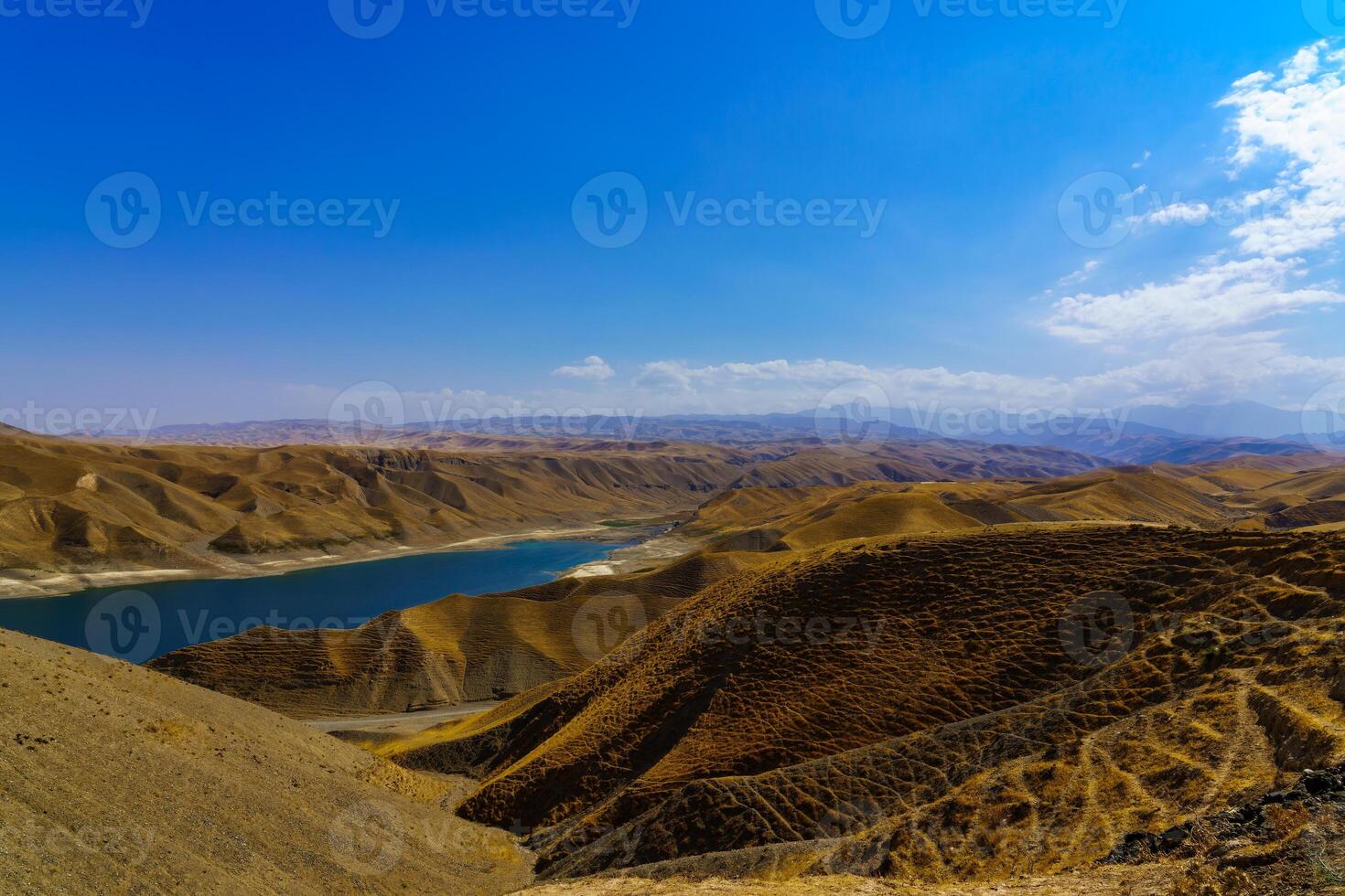 A deserted part of the Zaamin nature reserve in Uzbukistan on a sunny summer day. View of the mountains and reservoir. photo