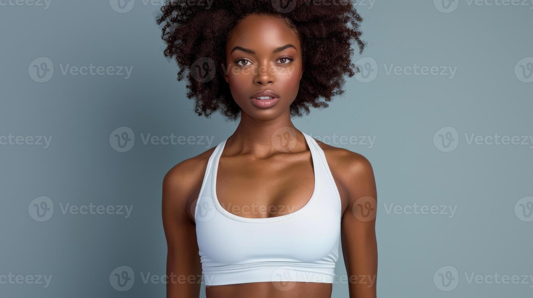 A woman in a white bra top posing for a picture photo