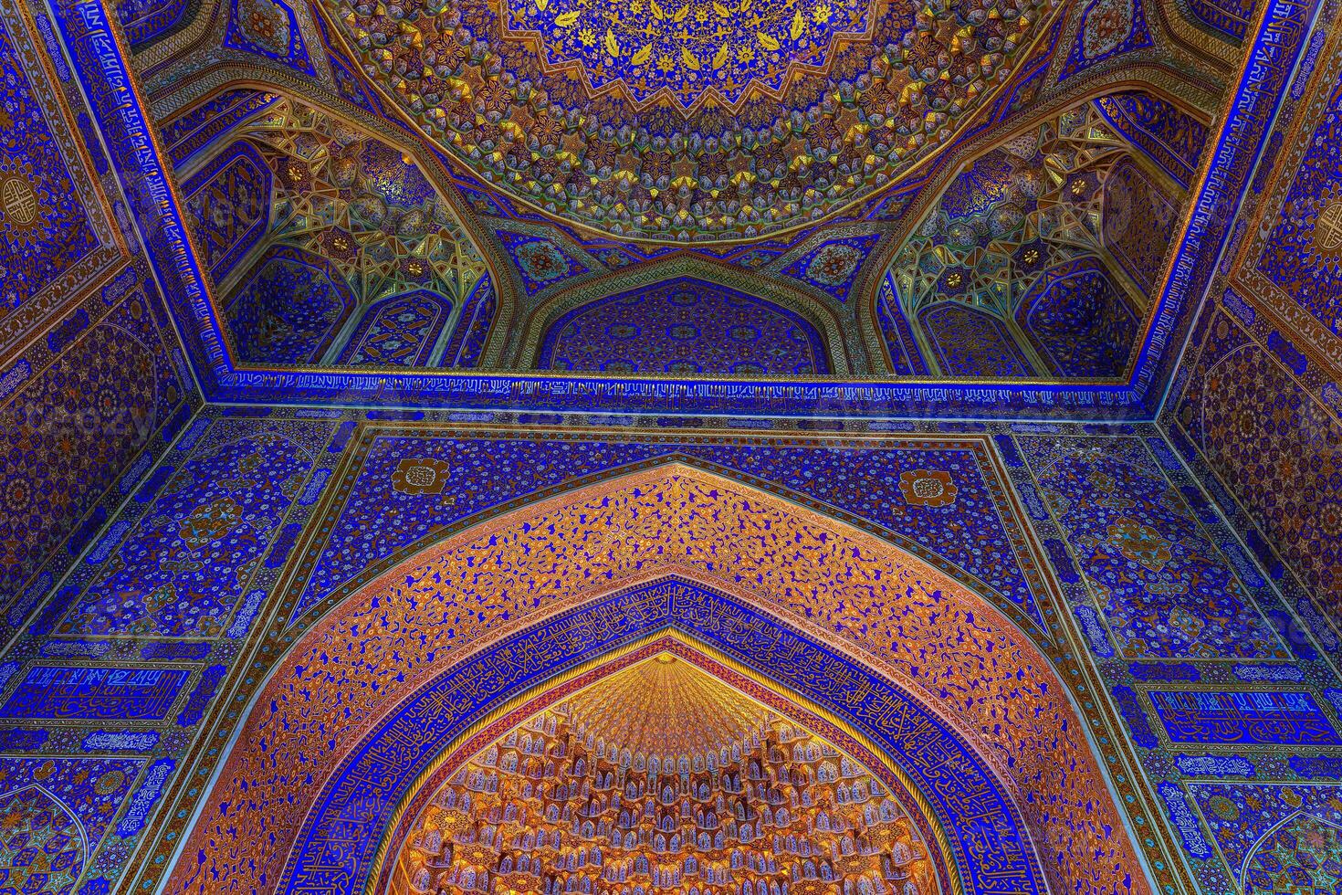 Ornament of the dome and interior of the Registan mosque in Samarkand, Uzbekistan. Muslim oriental traditional geometric ornament. photo