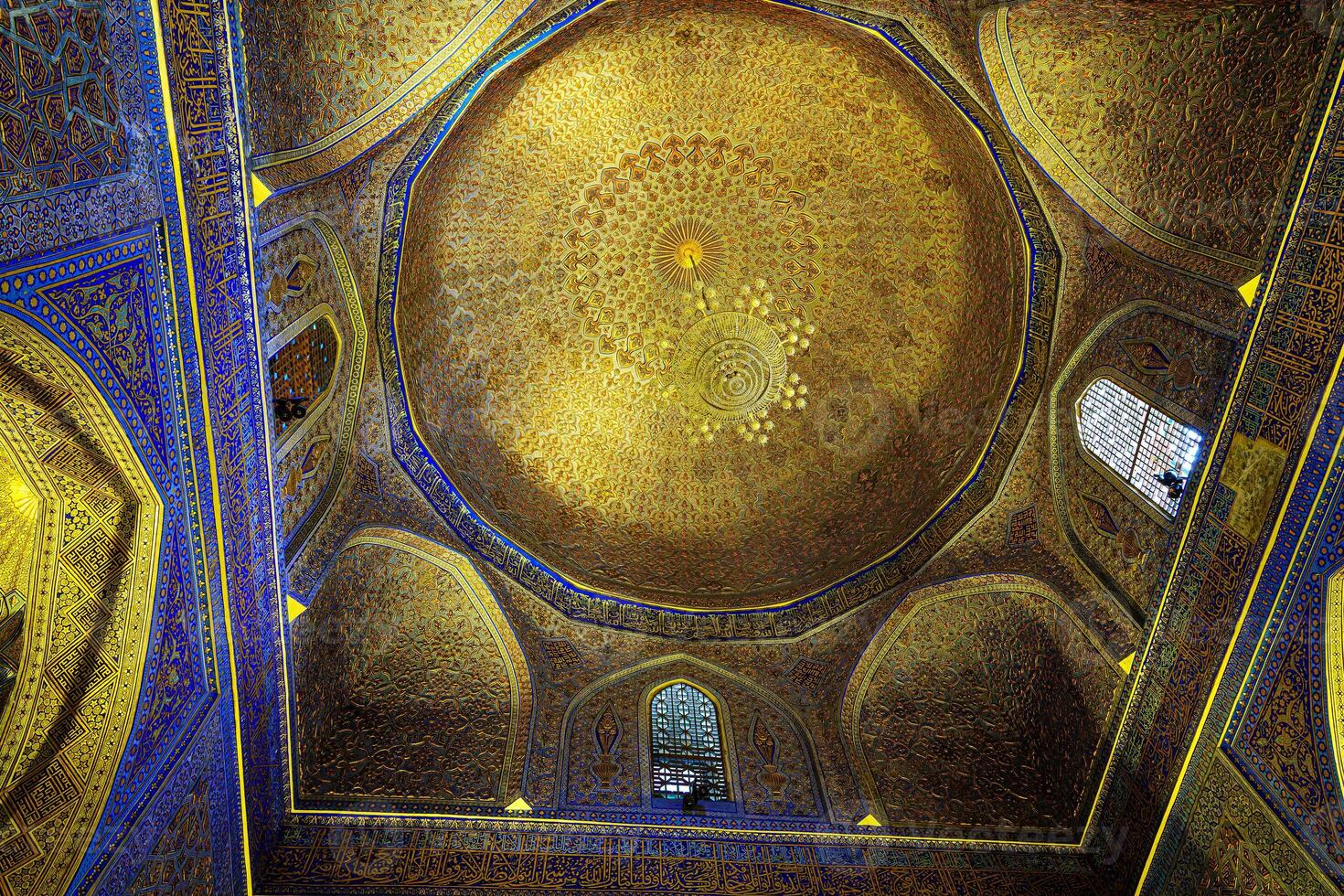 Ornament of the dome and interior of the Gur Emir mausoleum in Samarkand, Uzbekistan. Muslim oriental traditional geometric ornament. photo