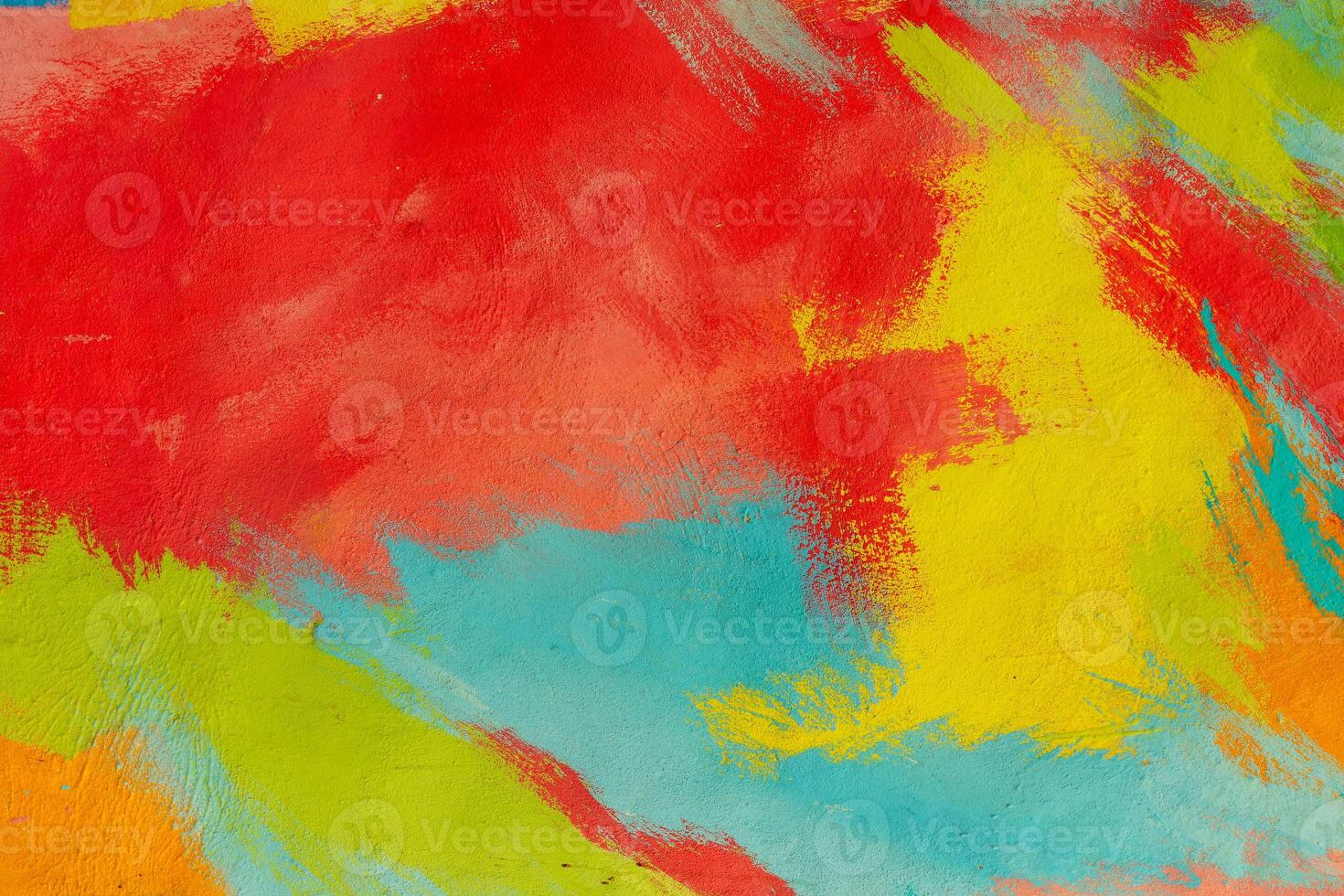 A fragment of colorful graffiti painted on a wall. Abstract urban background. Spray painting art. photo