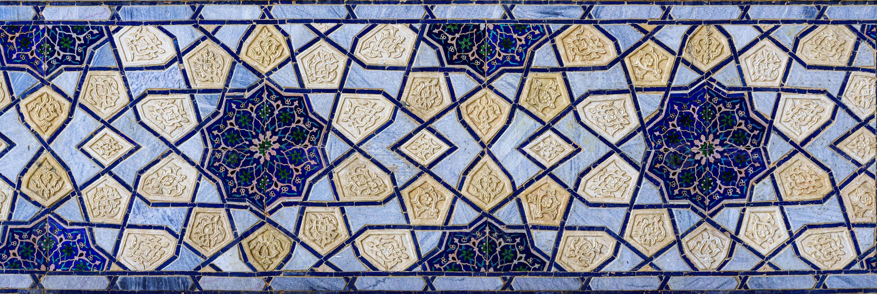 Geometric traditional Islamic ornament. Fragment of a ceramic mosaic. photo