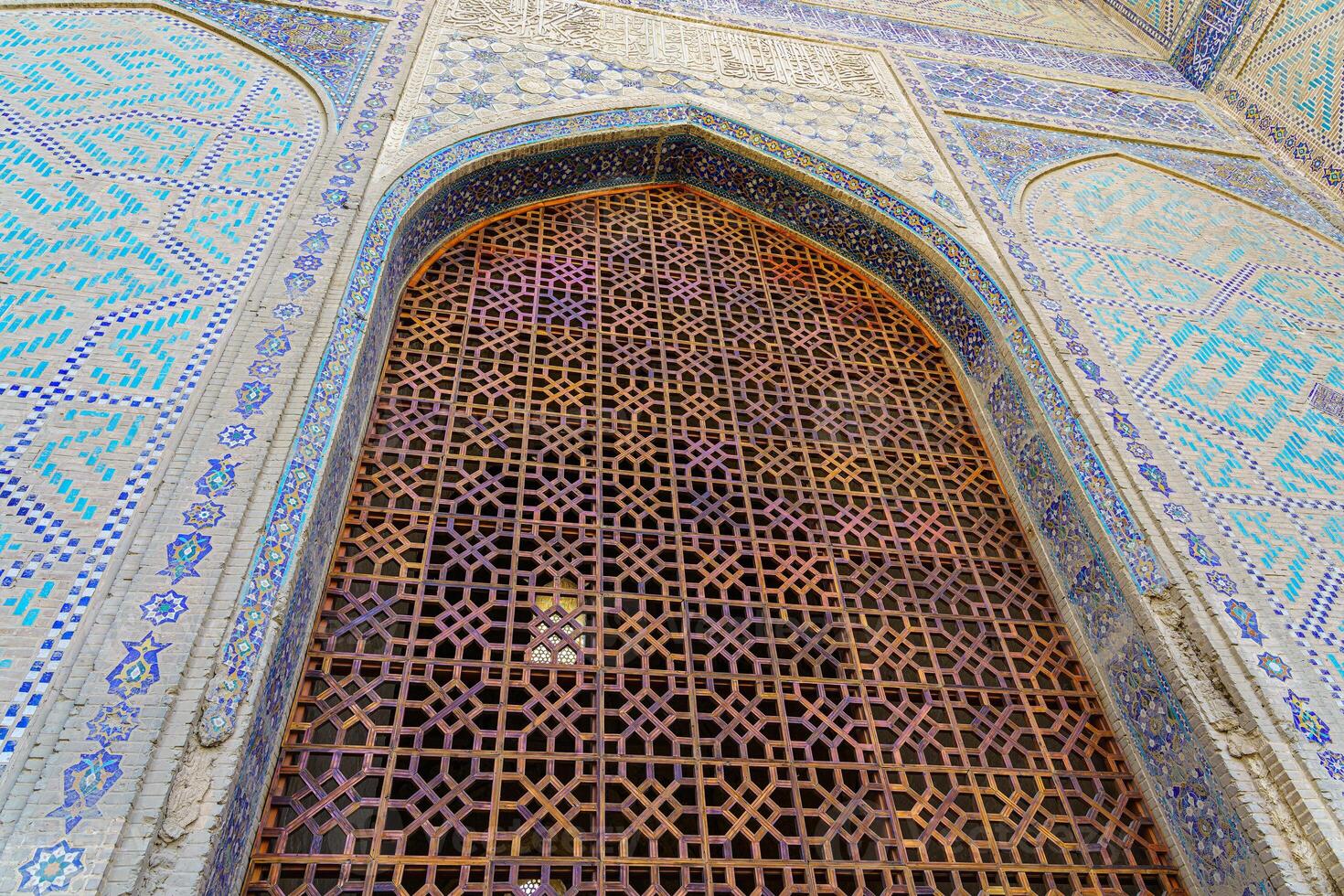 Ornament of the interior and gate of the Bibi Hanum mosque in Samarkand, Uzbekistan. Muslim oriental traditional geometric ornament. photo