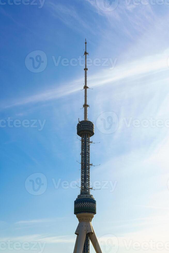 Tashkent Television Tower in Uzbekistan on a sundown cloudy sky background. photo