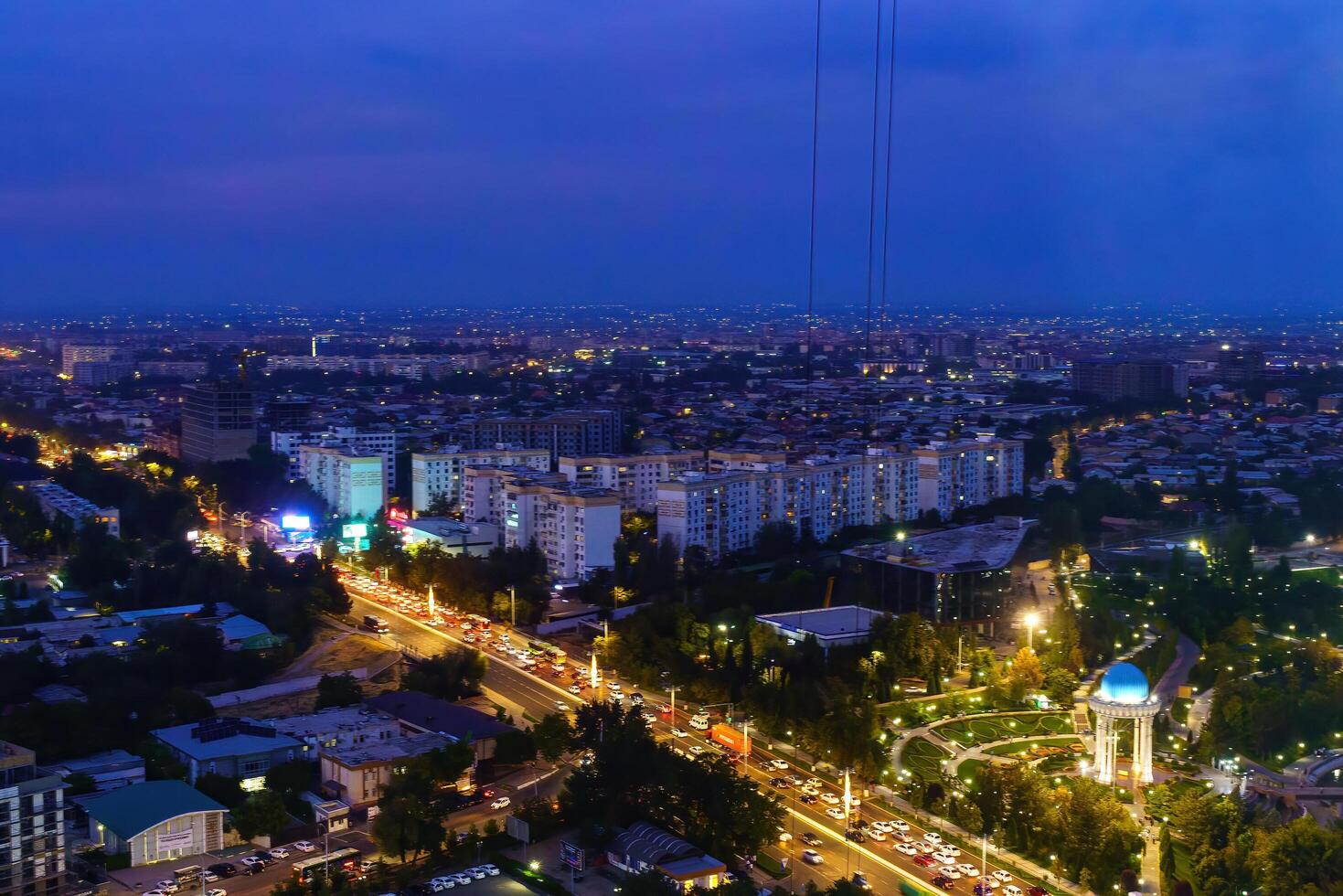 Uzbekistan, Tashkent - September 29, 2023 Top view from the observation deck on the Tashkent TV tower to the central part of the city covered with smog at nighttime . Air polution. photo