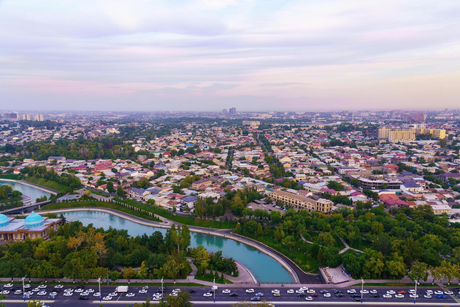 Uzbekistan, Tashkent - September 29, 2023 Top view from the observation deck on the Tashkent TV tower to the central part of the city covered with smog at sunset . Air polution. photo
