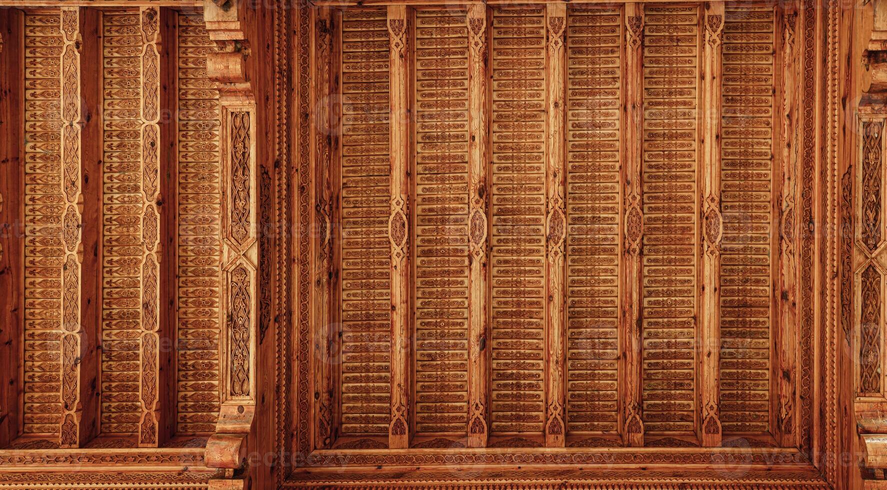 Fragment of an ancient carved wooden pattern. Ornate background. Abstract background. photo