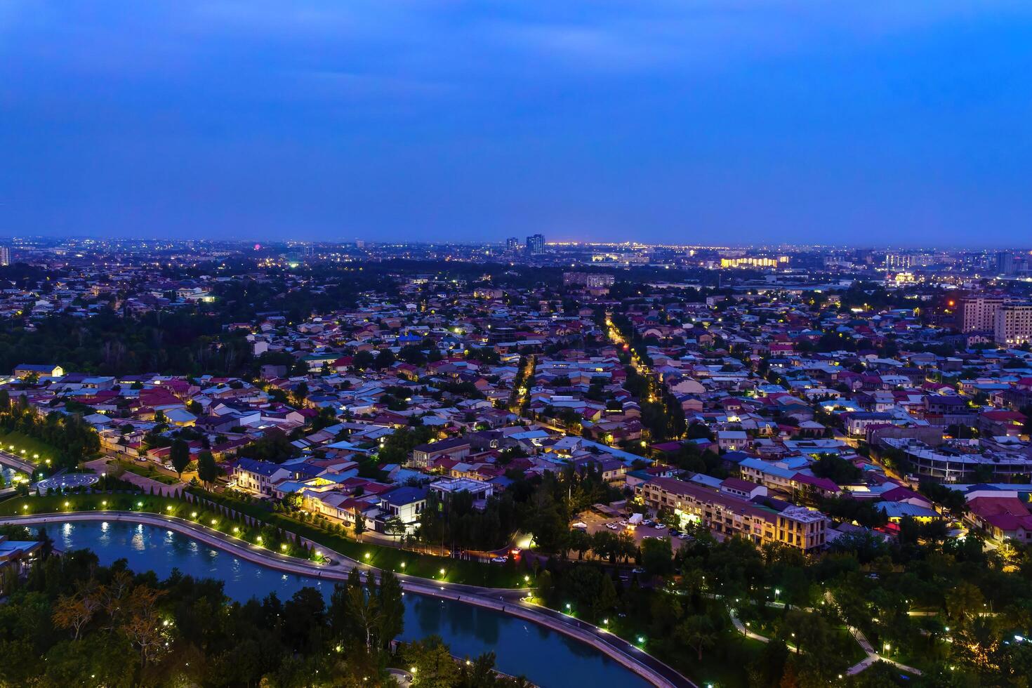 Uzbekistan, Tashkent - September 29, 2023 Top view from the observation deck on the Tashkent TV tower to the central part of the city covered with smog at nighttime . Air polution. photo