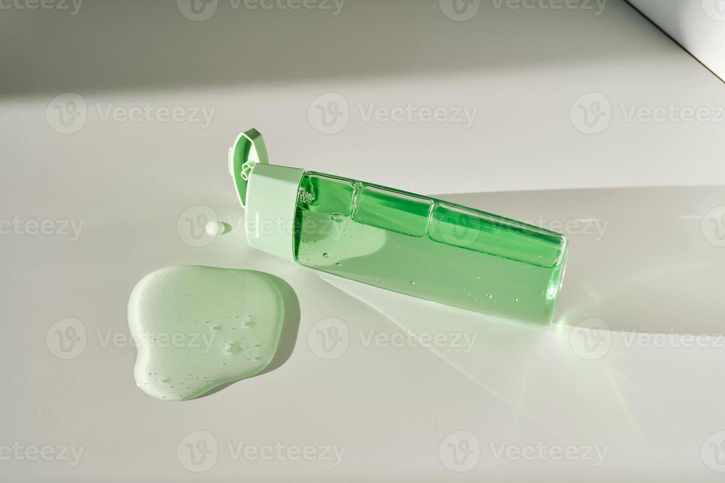 Shower gel or shampoo on a white background with sun light. photo