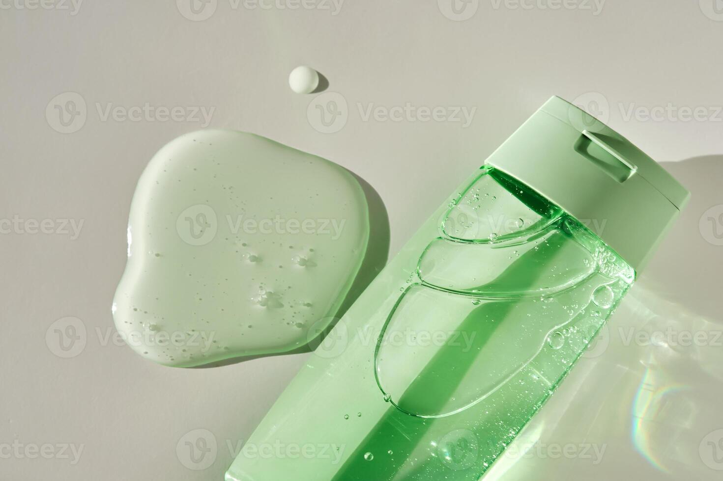 Shower gel or shampoo on a white background with sun light. photo