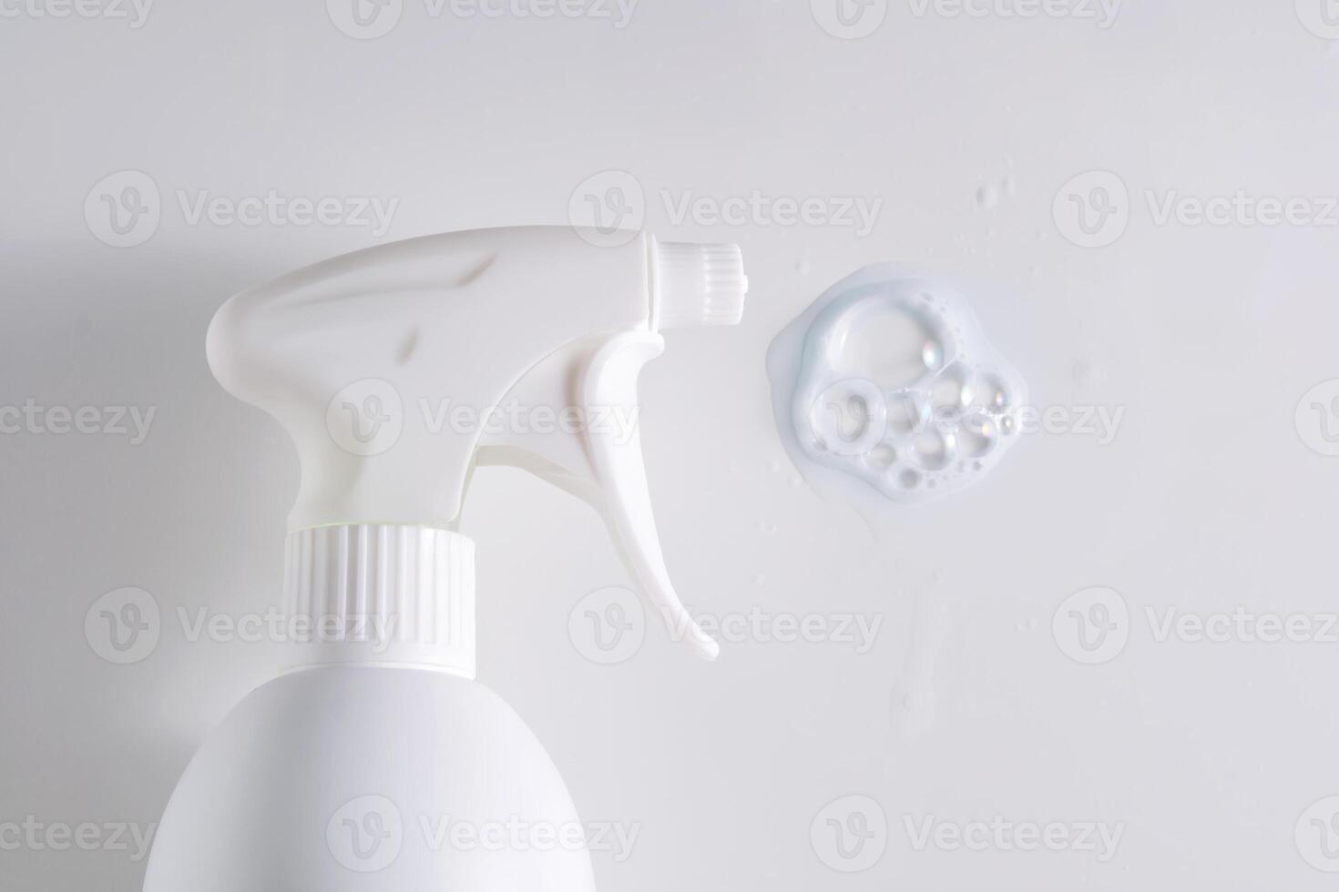 Cleaning product with a sprayer on a white background with with a sample. photo