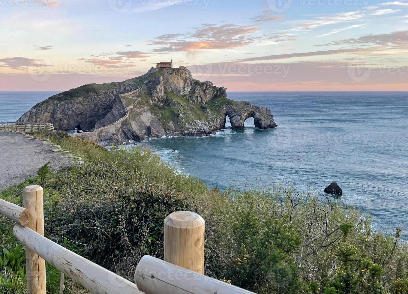 View over San Juan de Gaztelugatxe in Spain during sunrise photo