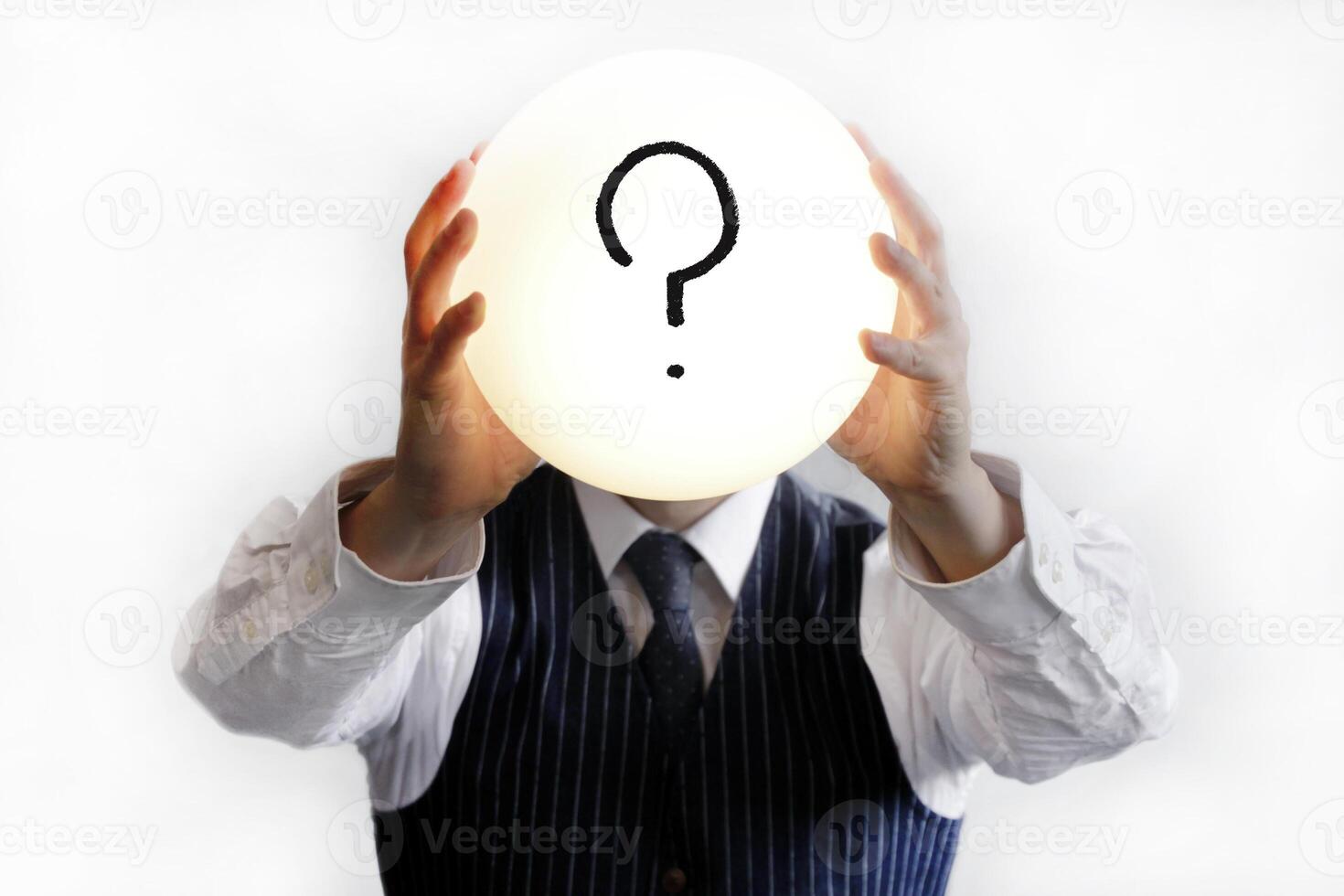 Question mark in a glowing bubble held by a man in shirt and tie photo