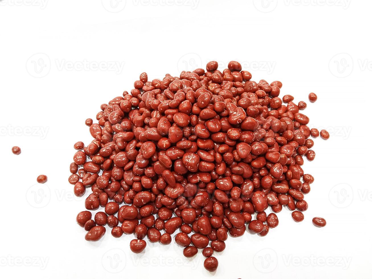 Chocolate pills coconut candy coatedin isolated on white background photo