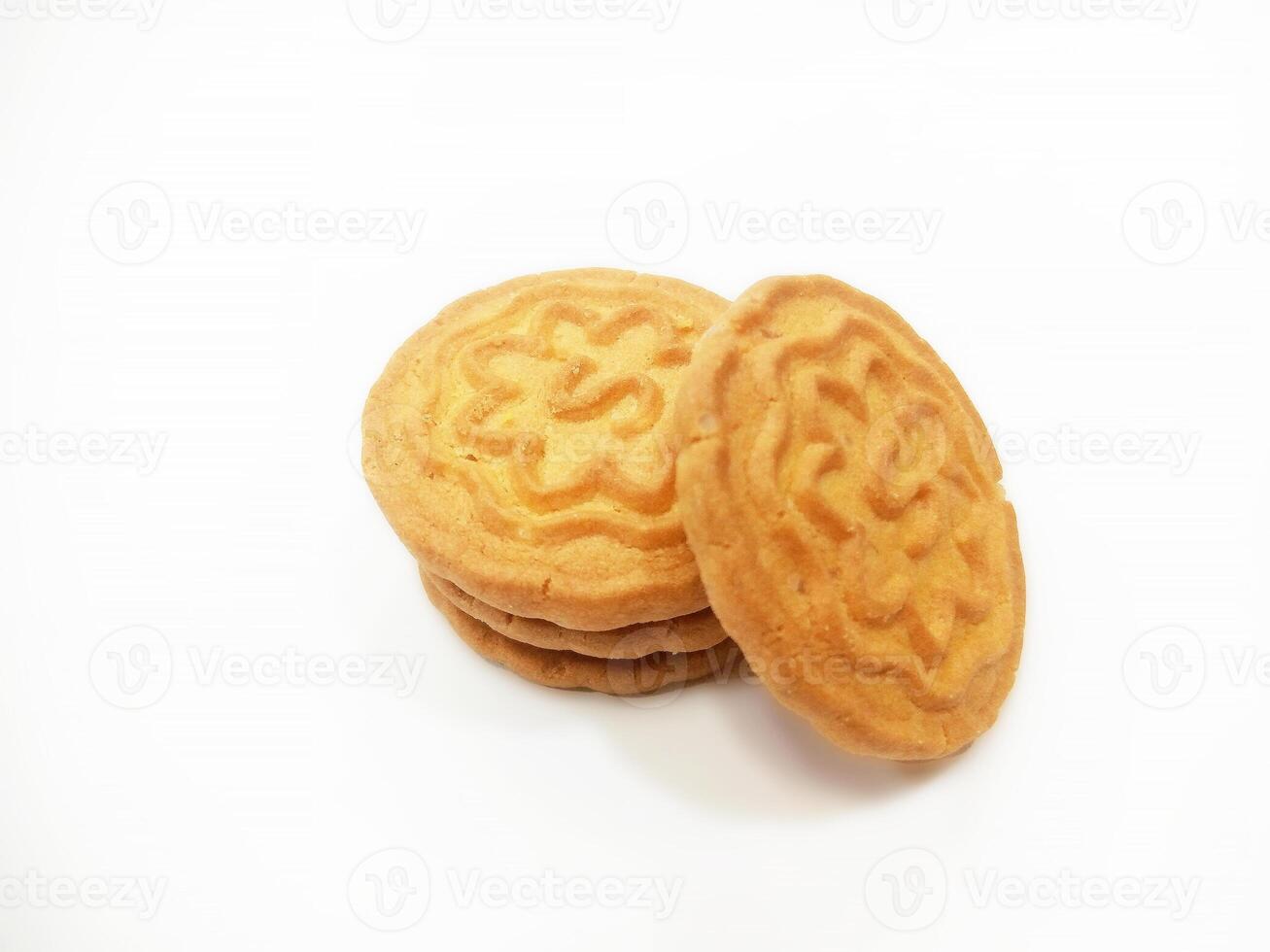 Wheat biscuits BISCUITS - A stack of delicious wheat round biscuits with a few crumbs isolated on white photo