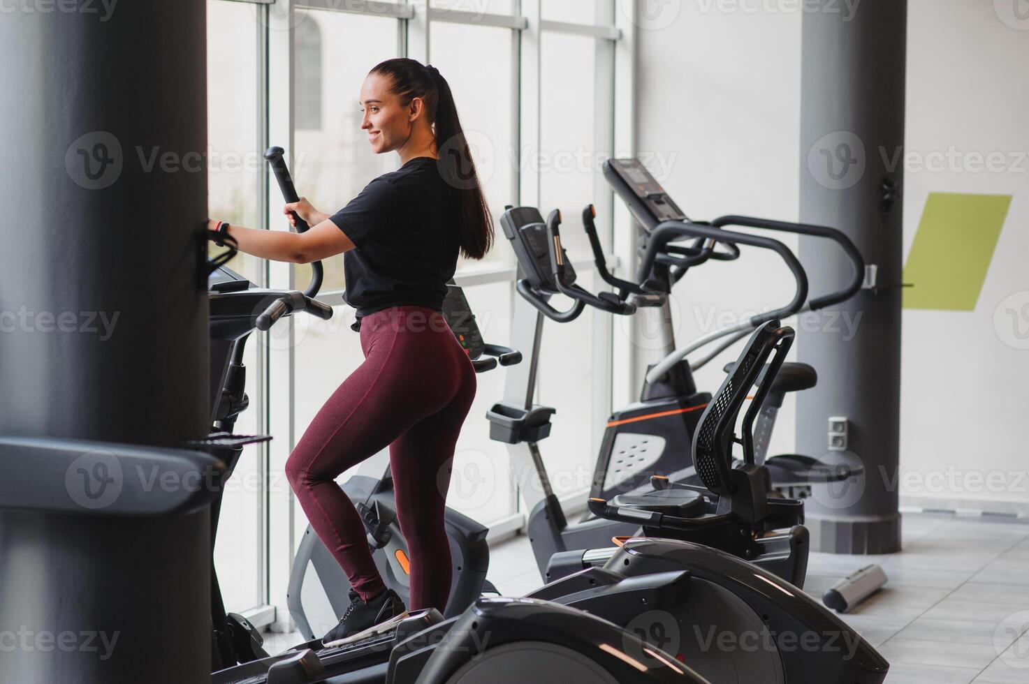 Woman was running on the treadmill in the gym photo