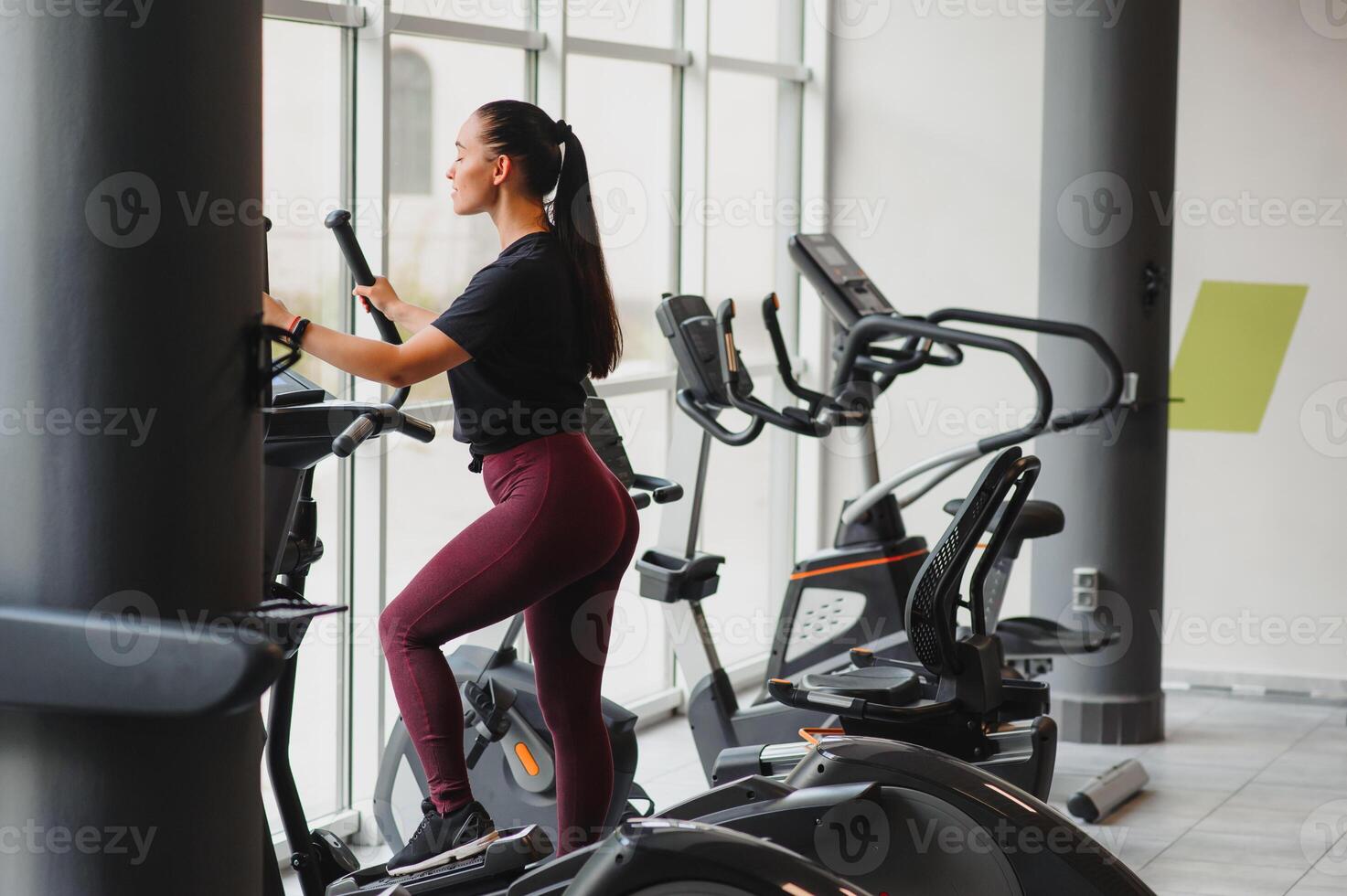 Woman was running on the treadmill in the gym photo