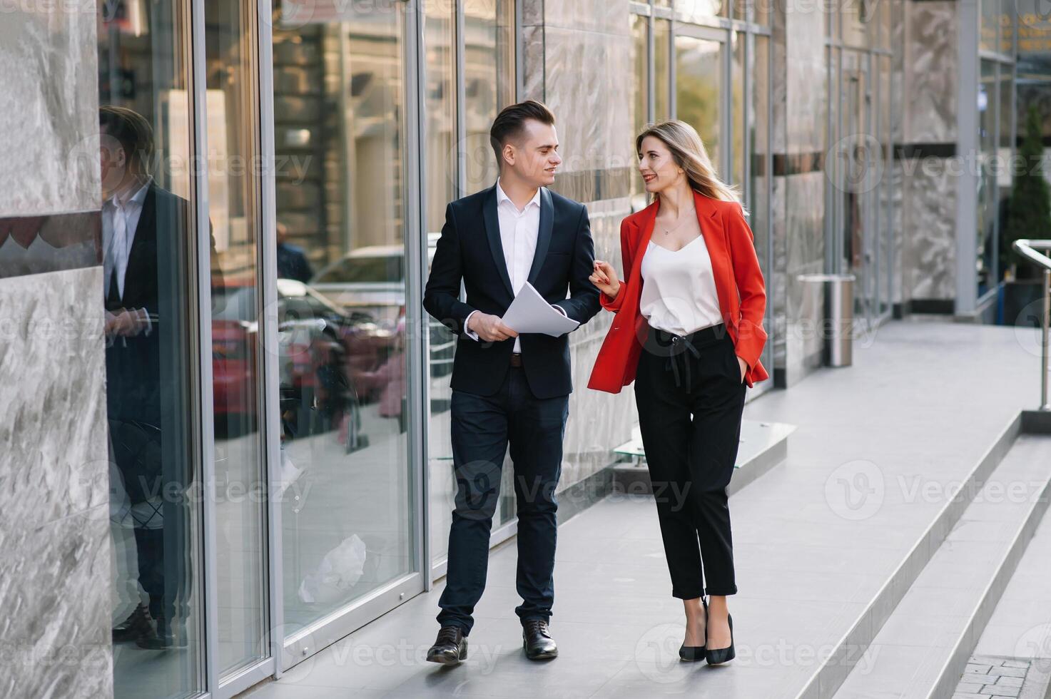 Business people walking and talking in the street photo