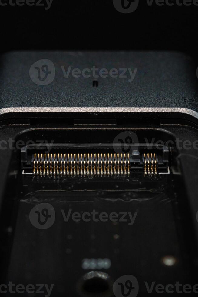 Speedy SSD Installation in Open Case with M.2 Connector on Black Background photo