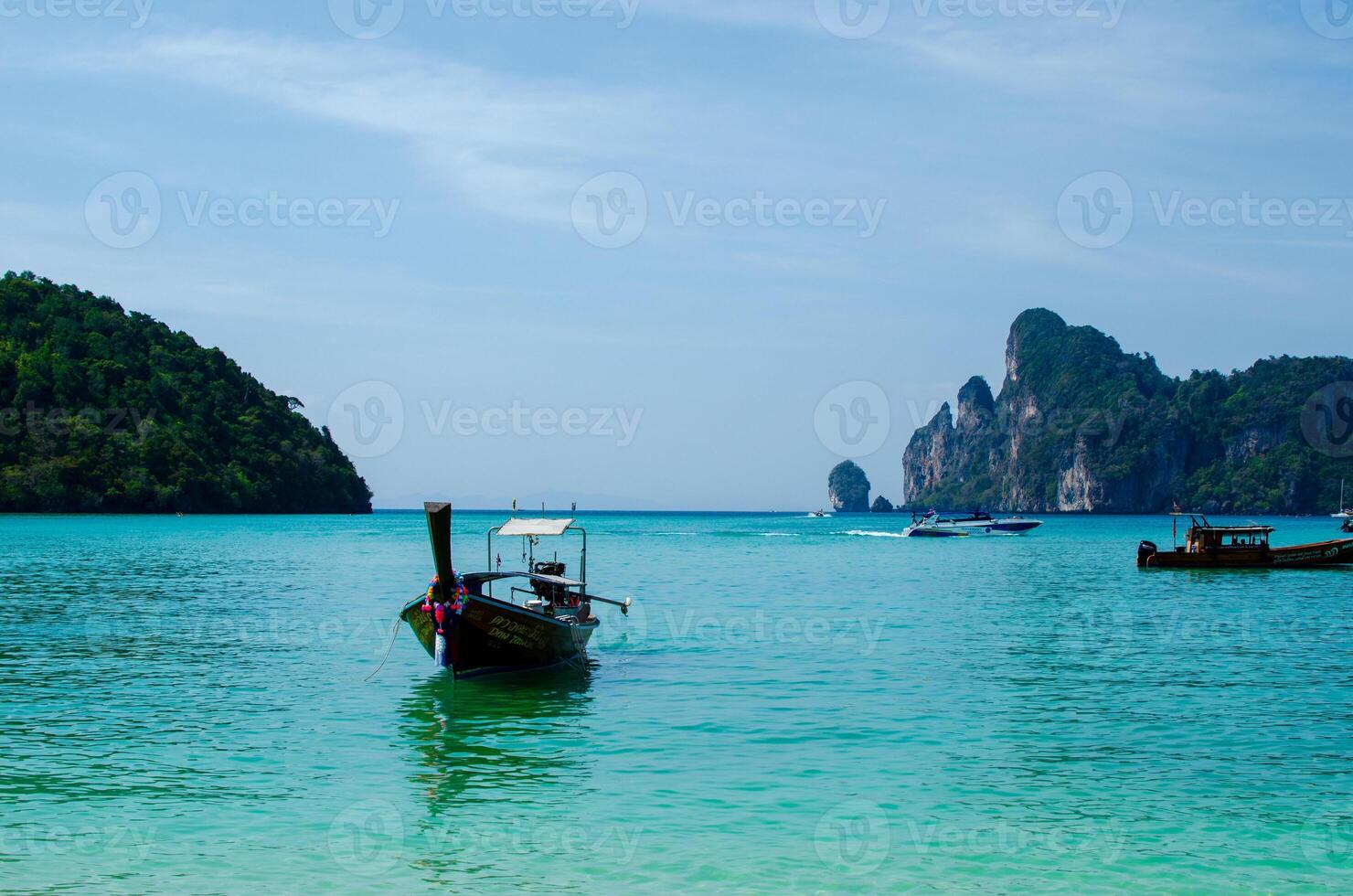 Views of the Islands of Thailand and turquoise water, rocks, yachts or boats photo