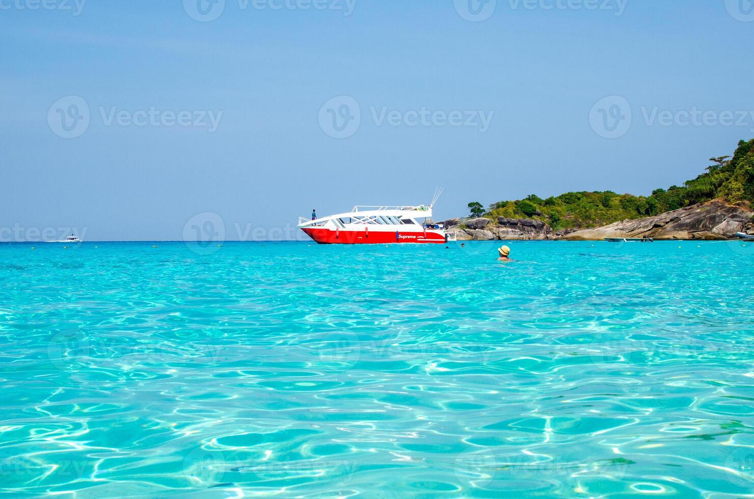 Tropical islands of ocean blue sea water and white sand beach at Similan Islands with famous Sail Rock, Phang Nga Thailand nature landscape photo