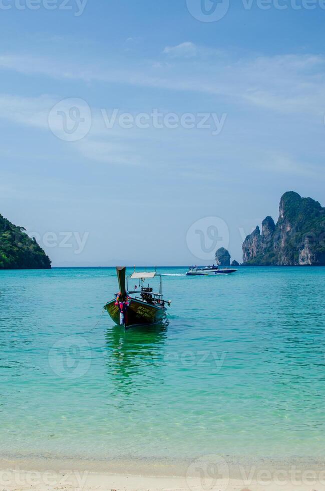 Views of the Islands of Thailand and turquoise water, rocks, yachts or boats photo