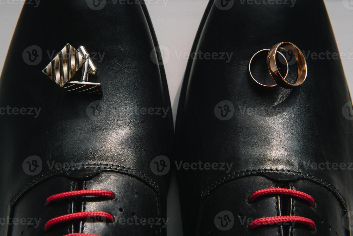 Men's leather shoes, watches and cufflinks on the background of a brown table. Clothing accessories businessman. Concept of grooms accessories at wedding day photo