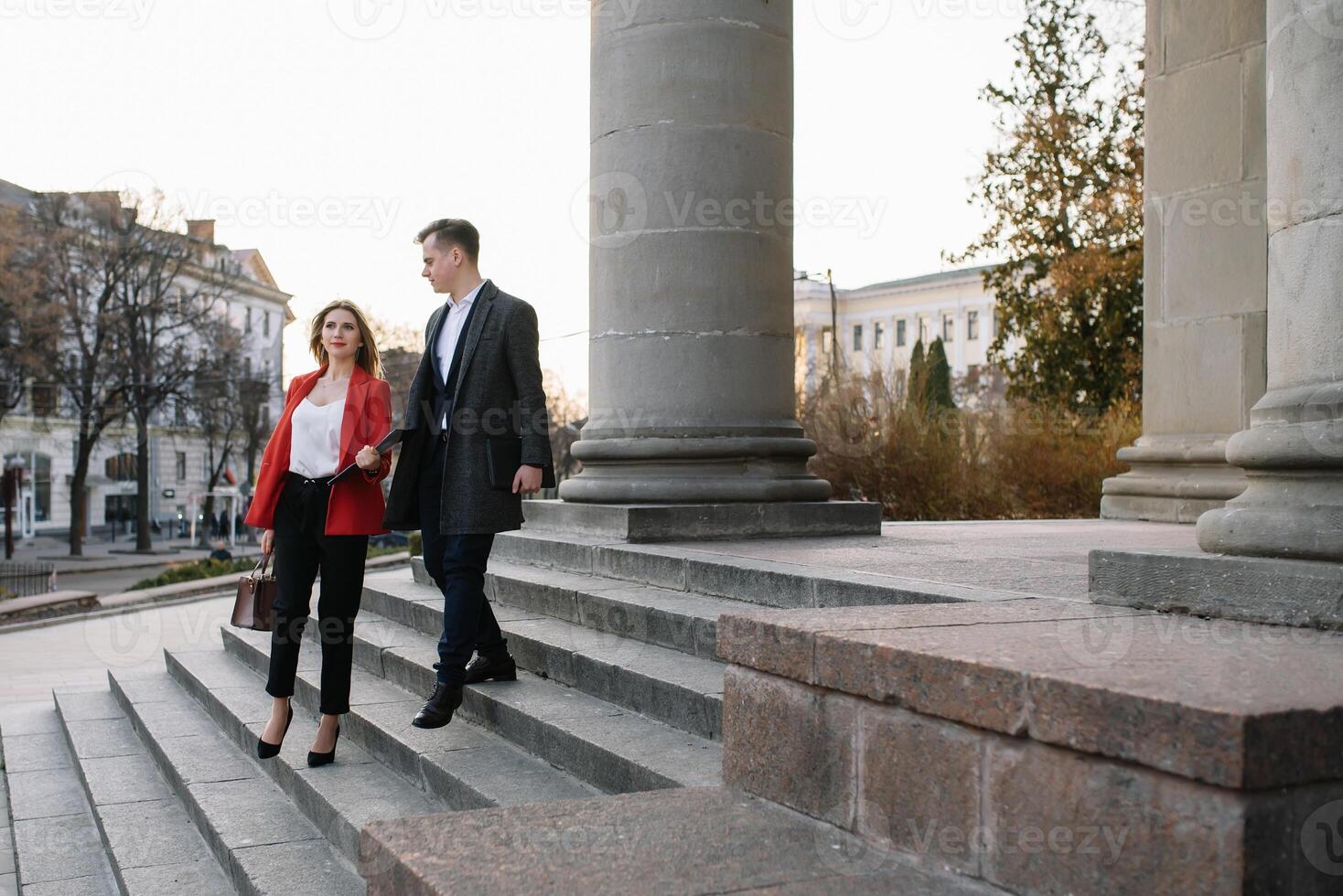 Business people walking and talking in the street photo