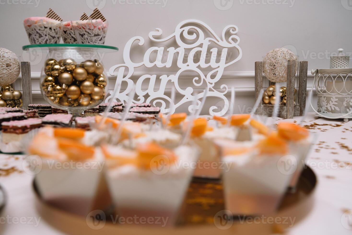 desserts with fruits, mousse, biscuits. Different types of sweet pastries, small colorful sweet cakes, macaron, and other desserts in the sweet buffet. candy bar for birthday photo