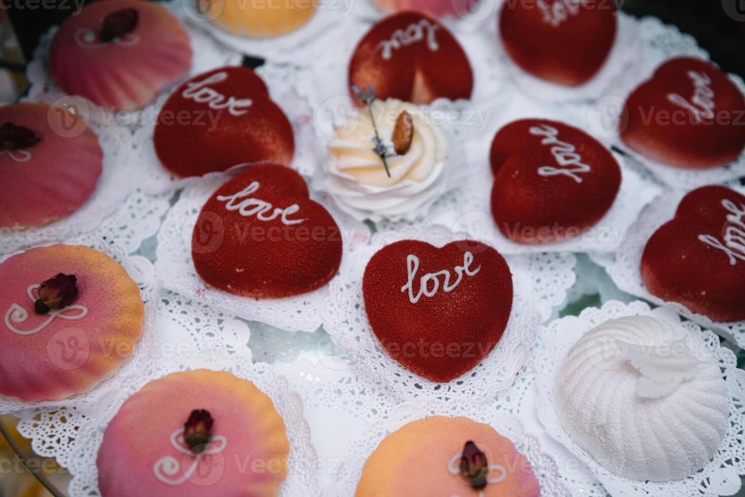 desserts with fruits, mousse, biscuits. Different types of sweet pastries, small colorful sweet cakes, macaron, and other desserts in the sweet buffet. candy bar for birthday. photo