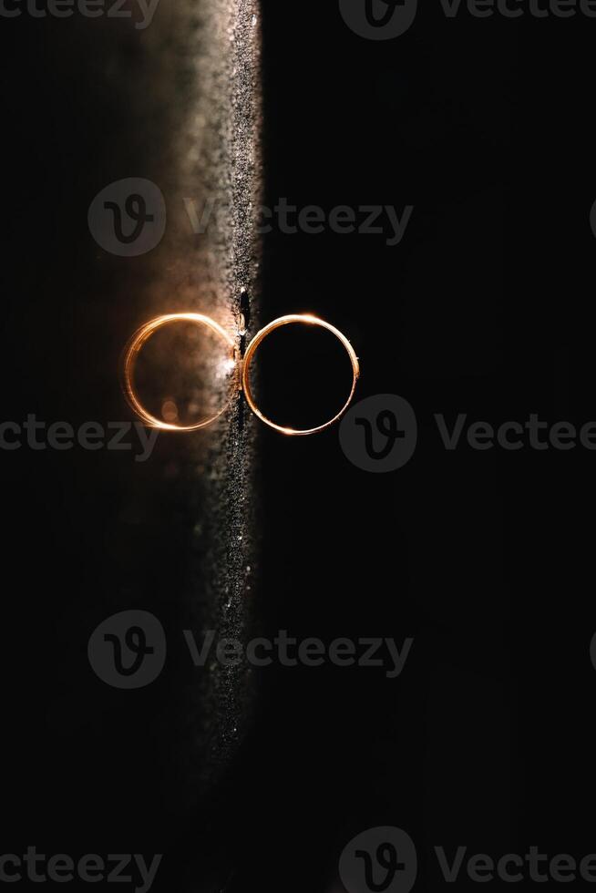 Beautiful wedding rings on light background. photo