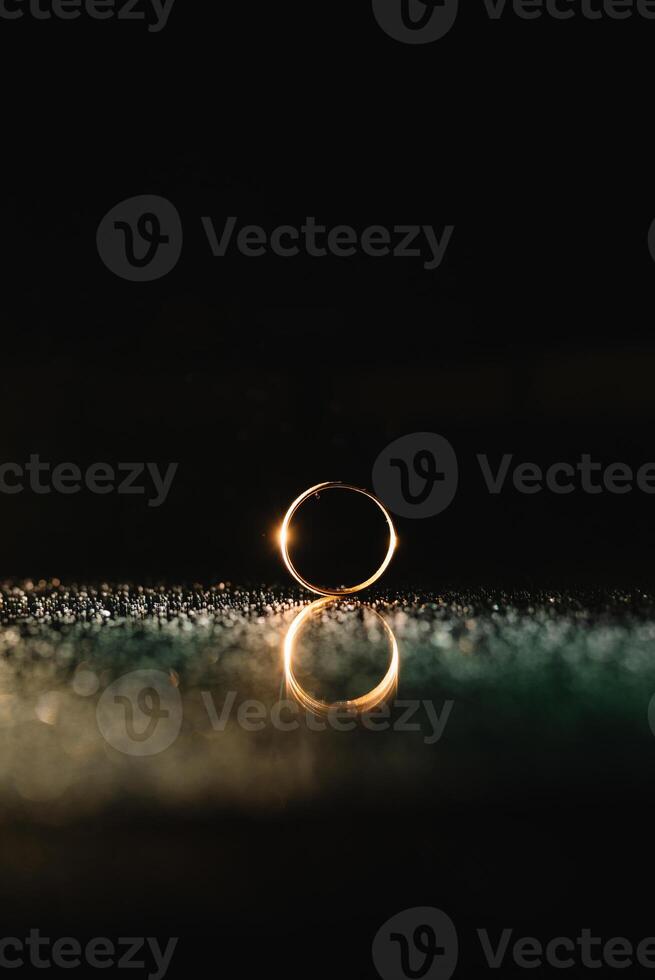 Beautiful wedding rings on light background. photo