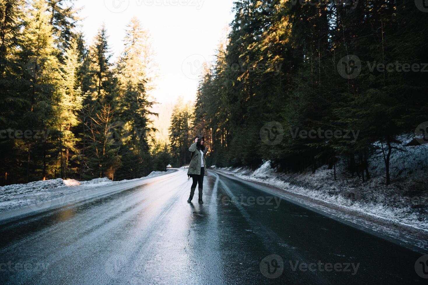 Happy girl with hat in forest at mountain road background, Relax time on holiday concept travel ,color of vintage tone and soft focus. photo