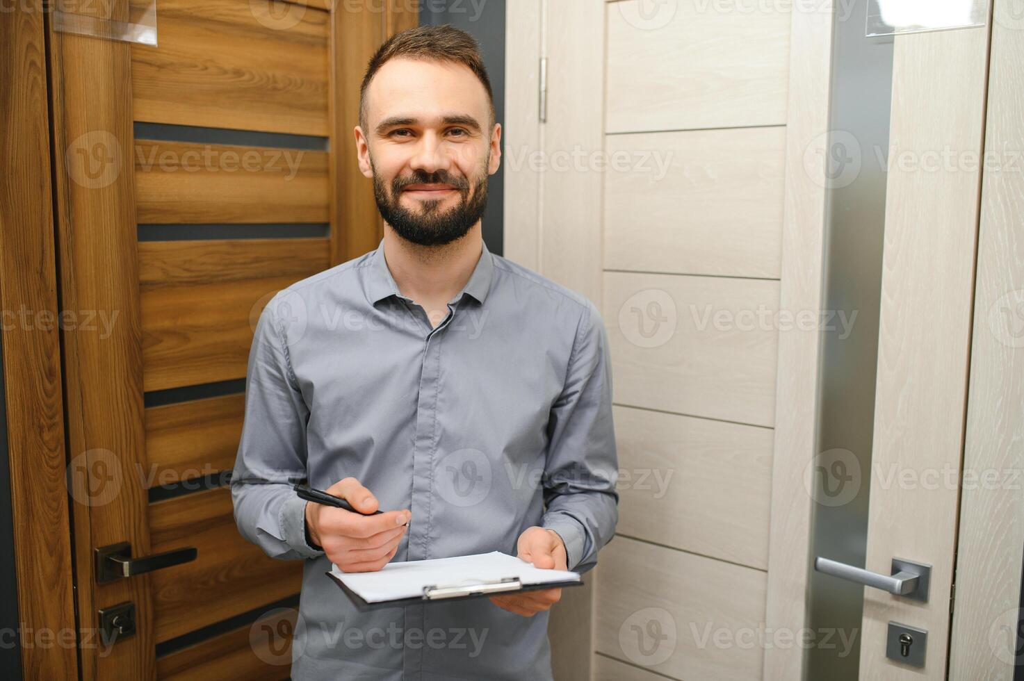 Seller of doors in a hardware store. Home repair concept. photo