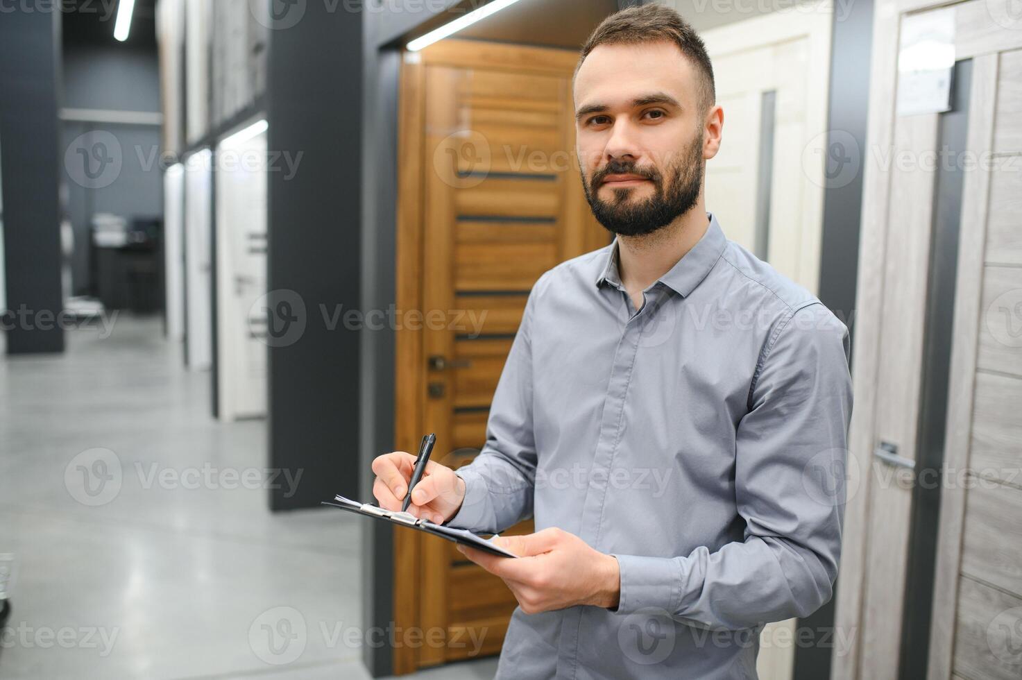 sales consultant standing near the interior door photo