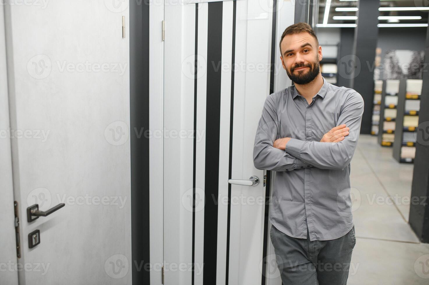 Seller of doors in a hardware store. Home repair concept. photo