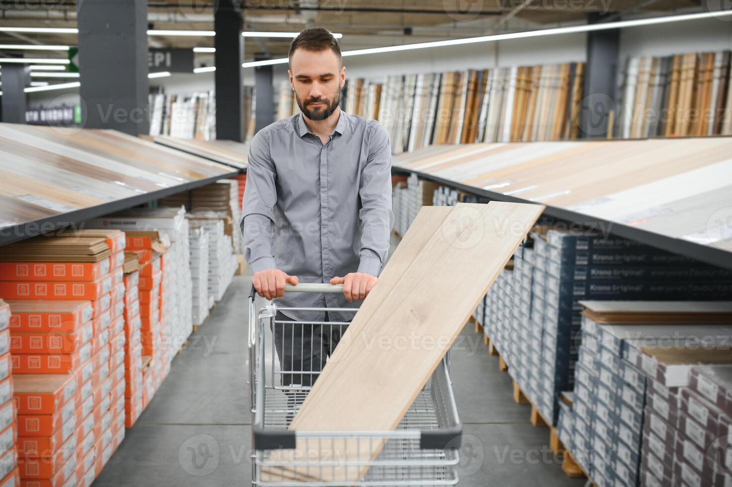 Man choosing flooring in hardware store photo